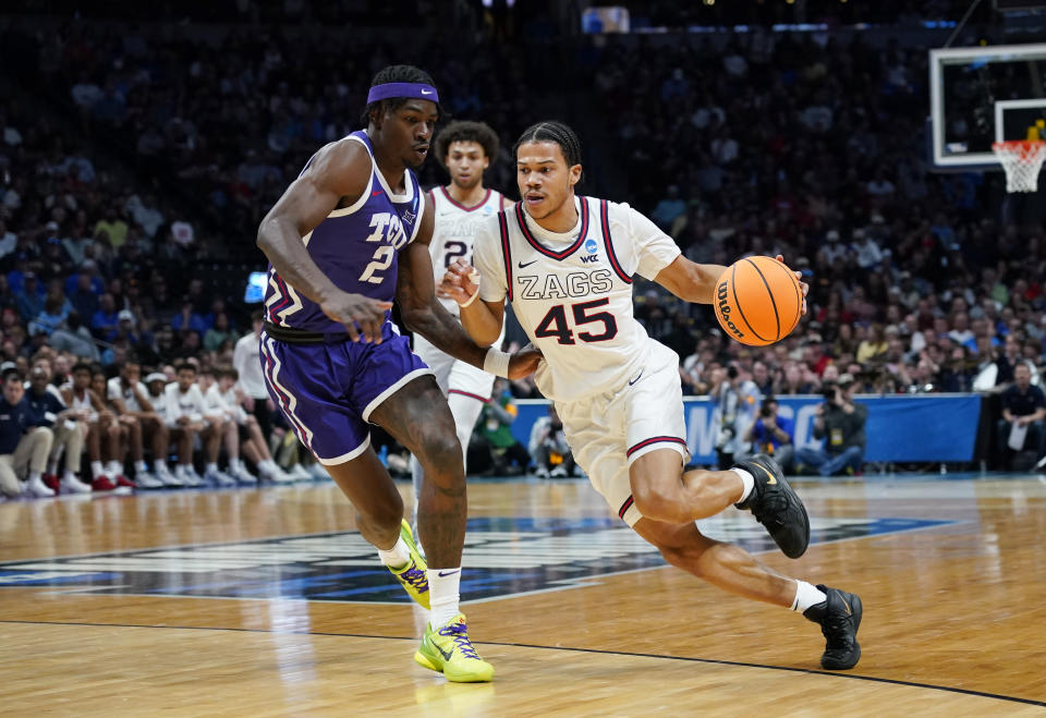 Gonzaga guard Rasir Bolton, right, drives against TCU forward Emanuel Miller during the first half of a second-round college basketball game in the men's NCAA Tournament on Sunday, March 19, 2023, in Denver. (AP Photo/John Leyba)
