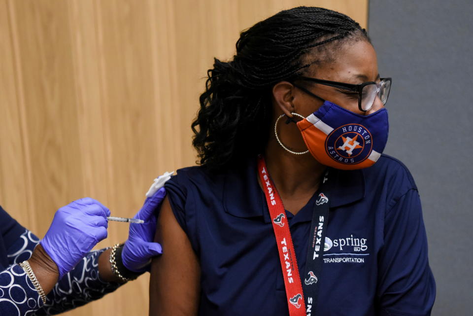 A patient in Houston, receives a COVID-19 vaccine in October after the Republican governor of Texas, Greg Abbott, banned COVID-19 vaccine mandates by any entity, including private employers.