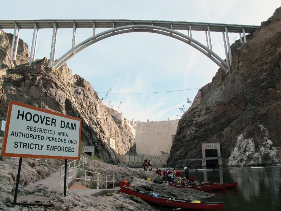 This April 13, 2013 photo shows the put-in area at the base of the Hoover Dam, outside of Boulder City, Nev.,for trips on the Colorado River by kayak, canoe and raft. The dam’s power plant is located in a restricted security zone, but so anyone looking to paddle there must be escorted by government-authorized livery services or outfitters. Some of the guide companies will pick you up at your hotel on the Las Vegas Strip some 30 miles away first thing in the morning and have you in the water before lunch. (AP Photo/Karen Schwartz)