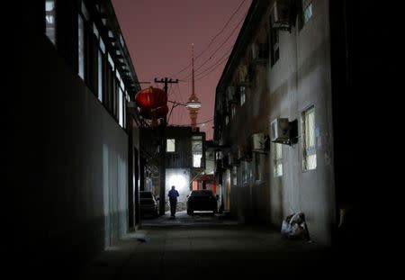 A man walks past the accommodation where some patients and their family members stay while seeking medical treatment in Beijing, China, April 21, 2016. REUTERS/Kim Kyung-Hoon