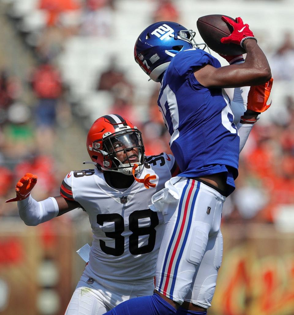 Cleveland Browns cornerback A.J. Green (38) defends a pass against New York Giants wide receiver Damion Willis (87) during the second half of an NFL preseason football game, Sunday, Aug. 22, 2021, in Cleveland, Ohio. [Jeff Lange/Beacon Journal]
