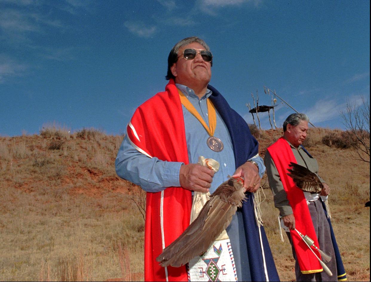 Cheyenne elder and peace chief Lawrence Hart, left, conducts a memorial ceremony at the Washita massacre site in 1995.