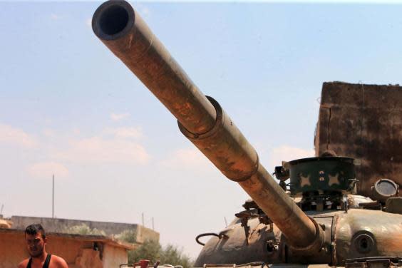 Syrian government forces gather near the town of Khan Shaykhun in the southern countryside of the rebel-held Idlib province (AFP/Getty Images)