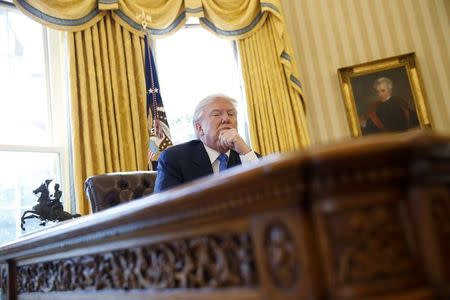U.S. President Donald Trump pauses during an an interview with Reuters in the Oval Office at the White House in Washington, U.S., February 23, 2017. REUTERS/Jonathan Ernst