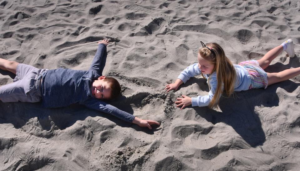 The Sines family from Ohio were at Disney and decided to rent an Air BnB in Cococa Beach and hit the beach. With the weather they haven't been able to go swimming in the ocean and the pool at their Air BnB was too cold to swim in. The children, Weston, 7, and daugher Adelyn, 4, just played in the sand.