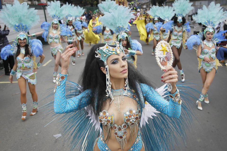 <p>Costumed revellers perform in the parade during the Notting Hill Carnival in London, Monday, Aug. 27, 2018. (Photo: Tim Ireland/AP) </p>