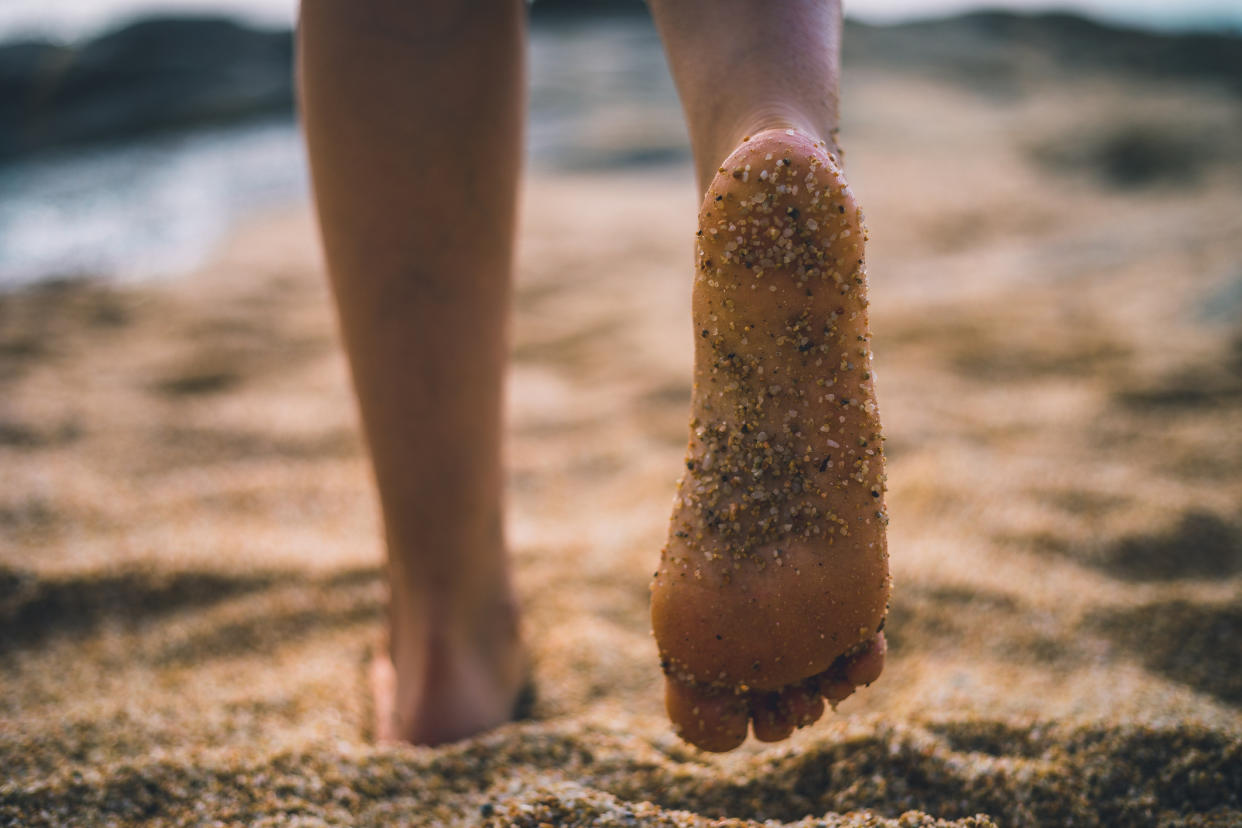 A woman has shared a genius hack for getting sand off your feet after a day at the beach. (Getty Images)