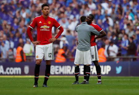 Soccer Football - FA Cup Final - Chelsea vs Manchester United - Wembley Stadium, London, Britain - May 19, 2018 Manchester United's Paul Pogba and Chris Smalling look dejected at the end of the match Action Images via Reuters/Lee Smith