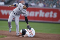 Baltimore Orioles' Anthony Santander is safe on a steal as New York Yankees second baseman Gleyber Torres tries to tag him during the third inning of a baseball game Thursday, Sept. 16, 2021, in Baltimore. (AP Photo/Gail Burton)