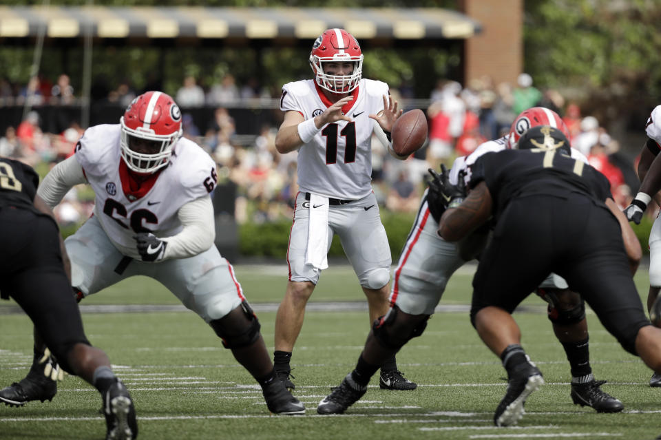 Georgia quarterback Jake Fromm (11) takes a snap against Vanderbilt in the first half of an NCAA college football game Saturday, Oct. 7, 2017, in Nashville, Tenn. (AP Photo/Mark Humphrey)