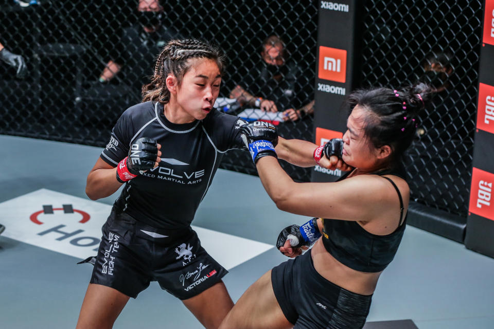 Victoria Lee (left) lands a jab on her Thai opponent Sunisa Srisen en route to winning her first professional MMA bout at ONE: Fists of Fury. (PHOTO: ONE Championship)