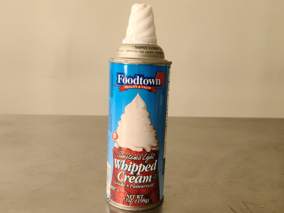 can of foodtown sweetened light whipped cream on a table