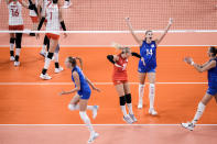 Russian Olympic Committee team players celebrate their victory over China during a women's volleyball preliminary round pool B match between China and Russian Olympic Committee at the 2020 Summer Olympics, Thursday, July 29, 2021, in Tokyo, Japan. (AP Photo/Manu Fernandez)