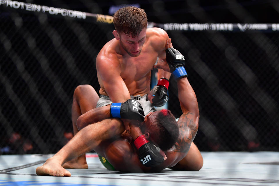 Feb 17, 2024; Anaheim, California, USA; Oban Elliott pins Val Woodburn to the mat during UFC 298 at Honda Center. Mandatory Credit: Gary A. Vasquez-USA TODAY Sports