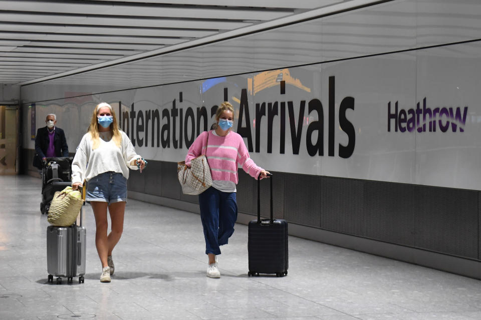 Passengers wearing face masks as they arrive at Heathrow Airport after a flight from Dubrovnik, Croatia, landed. The UK government announced that from 4am on Saturday, travellers to the UK from Croatia, Austria and Trinidad and Tobago will have to quarantine for 14 days on arrival.