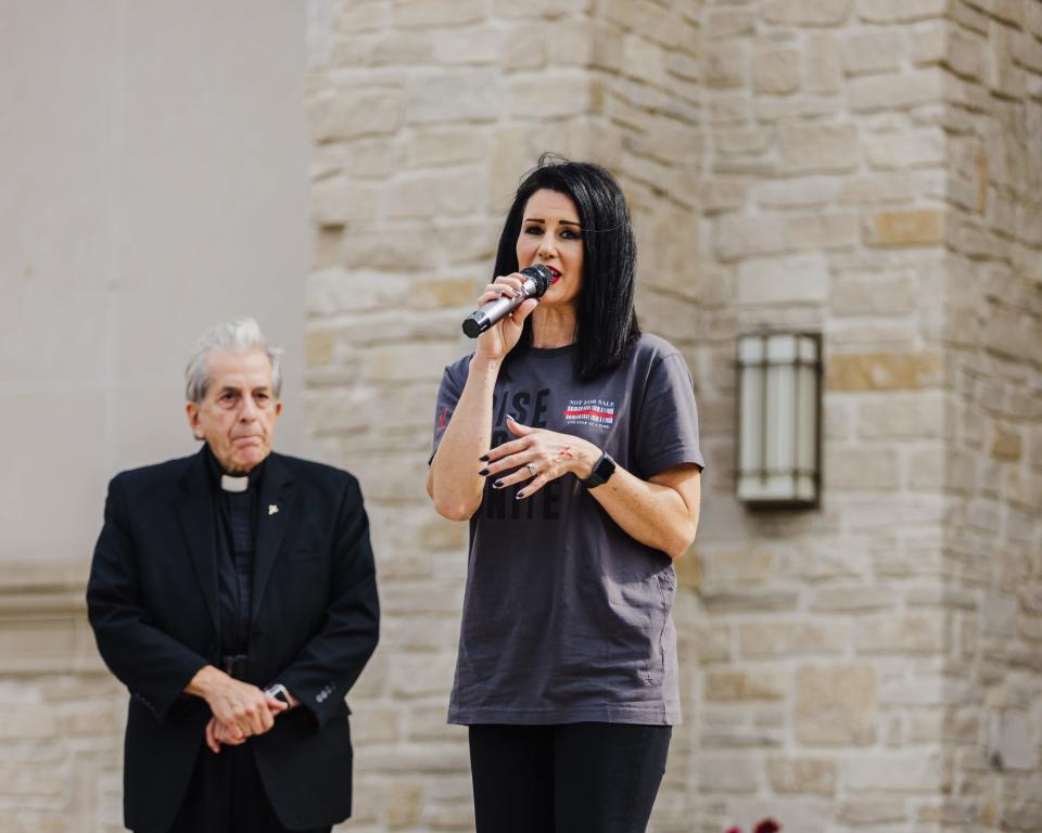 Kathie Gray, president of Not for Sale, an organization at Walsh University that highlights the issue of human trafficking and sextortion, speaks at a 2021 event the group sponsored on campus. This year's event and one-mile walk will be held Sept. 30 on campus.