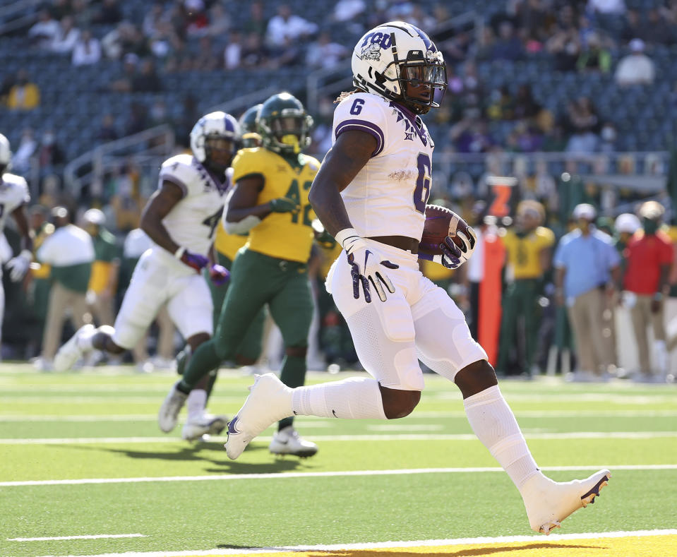 TCU running back Zach Evans (6) scores a touchdown against Baylor duirng the first half of an NCAA college football game in Waco, Texas, Saturday, Oct. 31, 2020. (Jerry Larson/Waco Tribune-Herald via AP)