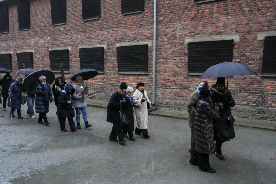 Holocaust survivors and relatives arrive at the Auschwitz Nazi death camp in Oswiecim, Poland, Saturday, Jan. 27, 2024. Survivors of Nazi death camps marked the 79th anniversary of the liberation of the Auschwitz-Birkenau camp during World War II in a modest ceremony in southern Poland.(AP Photo/Czarek Sokolowski)