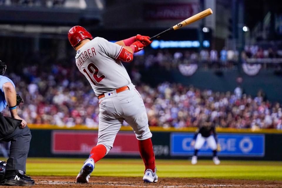 Philadelphia Phillies' Kyle Schwarber hits a home run against the Arizona Diamondbacks during the fourth inning in Game 4 of the baseball NL Championship Series in Phoenix, Friday, Oct. 20, 2023.(AP Photo/Ross D. Franklin)