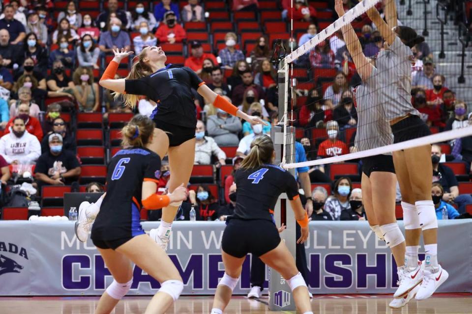 Boise State junior Lauren Ohlinger skies for a spike in the Broncos’ championship match win over UNLV on Friday, as Danielle Boss (6) and Alyssa Wissinger (4) look on. Ohlinger and Wissinger combined for 22 kills, and Boss had 40 assists and five kills.