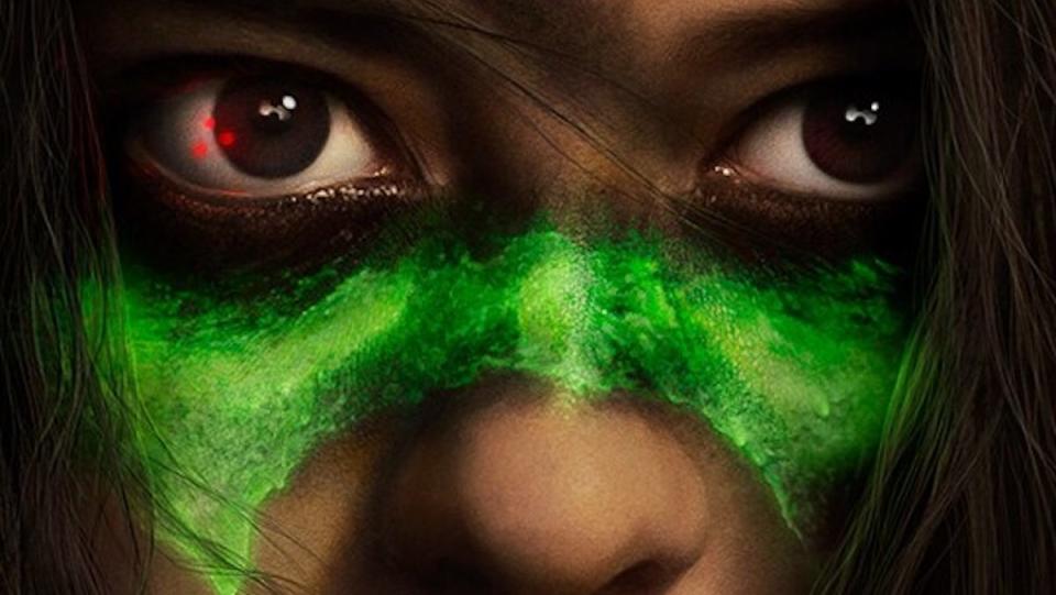 A woman's eyes with neon green paint underneath from a Prey poster