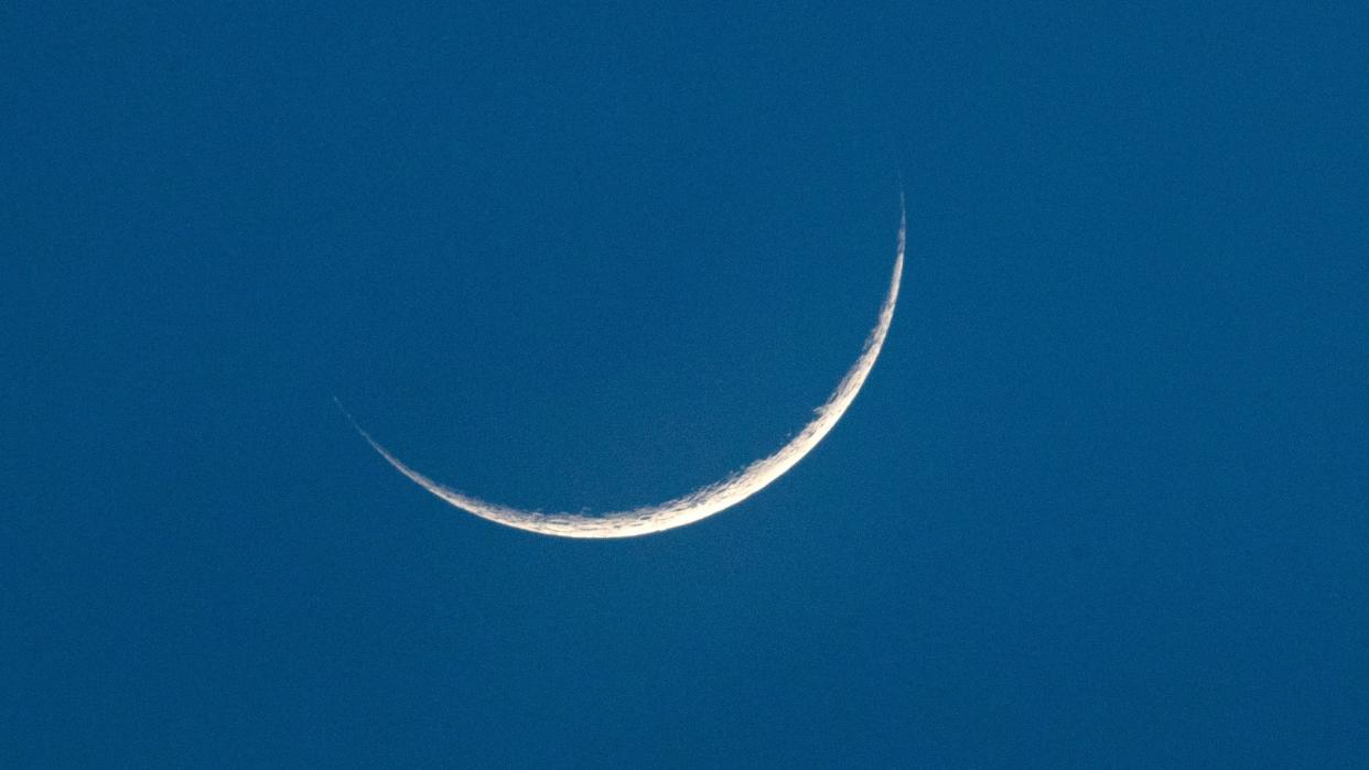  a tiny sliver of crescent moon 