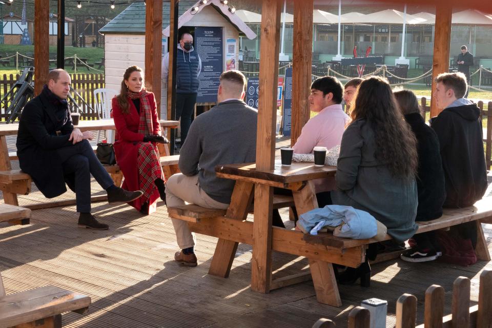 Britain's Prince William, Duke of Cambridge (L) and Britain's Catherine, Duchess of Cambridge (2nd L) meet local university students and hear about some of the challenges they have experienced during the pandemic during a visit to Cardiff Castle in Cardiff in south Wales, on December 8, 2020, on the final day of engagements on their tour of the UK. - During their trip, their Royal Highnesses hope to pay tribute to individuals, organisations and initiatives across the country that have gone above and beyond to support their local communities this year. (Photo by Jonathan Buckmaster / POOL / AFP) (Photo by JONATHAN BUCKMASTER/POOL/AFP via Getty Images)