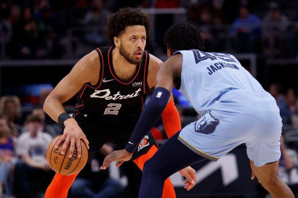 Pistons guard Cade Cunningham dribbles defended by Grizzlies forward GG Jackson in the first half of the Pistons' 110-108 loss on Monday, April 1, 2024, at Little Caesars Arena.