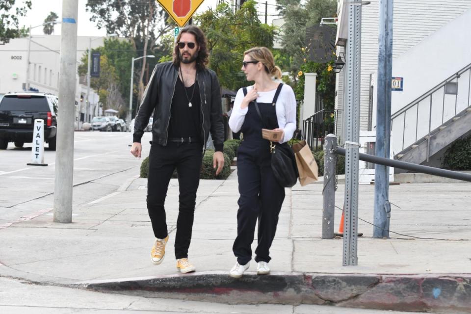 Russell Brand pictured with his wife Laura Gallacher (Alamy)