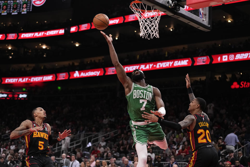 Boston Celtics guard Jaylen Brown (7) shoots against the Atlanta Hawks during the second half of Game 3 of a first-round NBA basketball playoff series, Friday, April 21, 2023, in Atlanta. (AP Photo/Brynn Anderson)