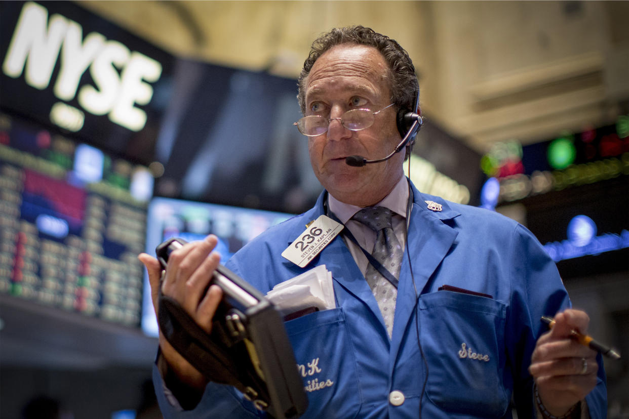 A trader works on the floor of the New York Stock Exchange October 1, 2014. U.S. stocks dropped more than 1 percent on Wednesday as the first diagnosis of Ebola in a patient in the United States spooked investors, and the Russell 2000 index ended in correction territory. REUTERS/Brendan McDermid (UNITED STATES - Tags: BUSINESS)