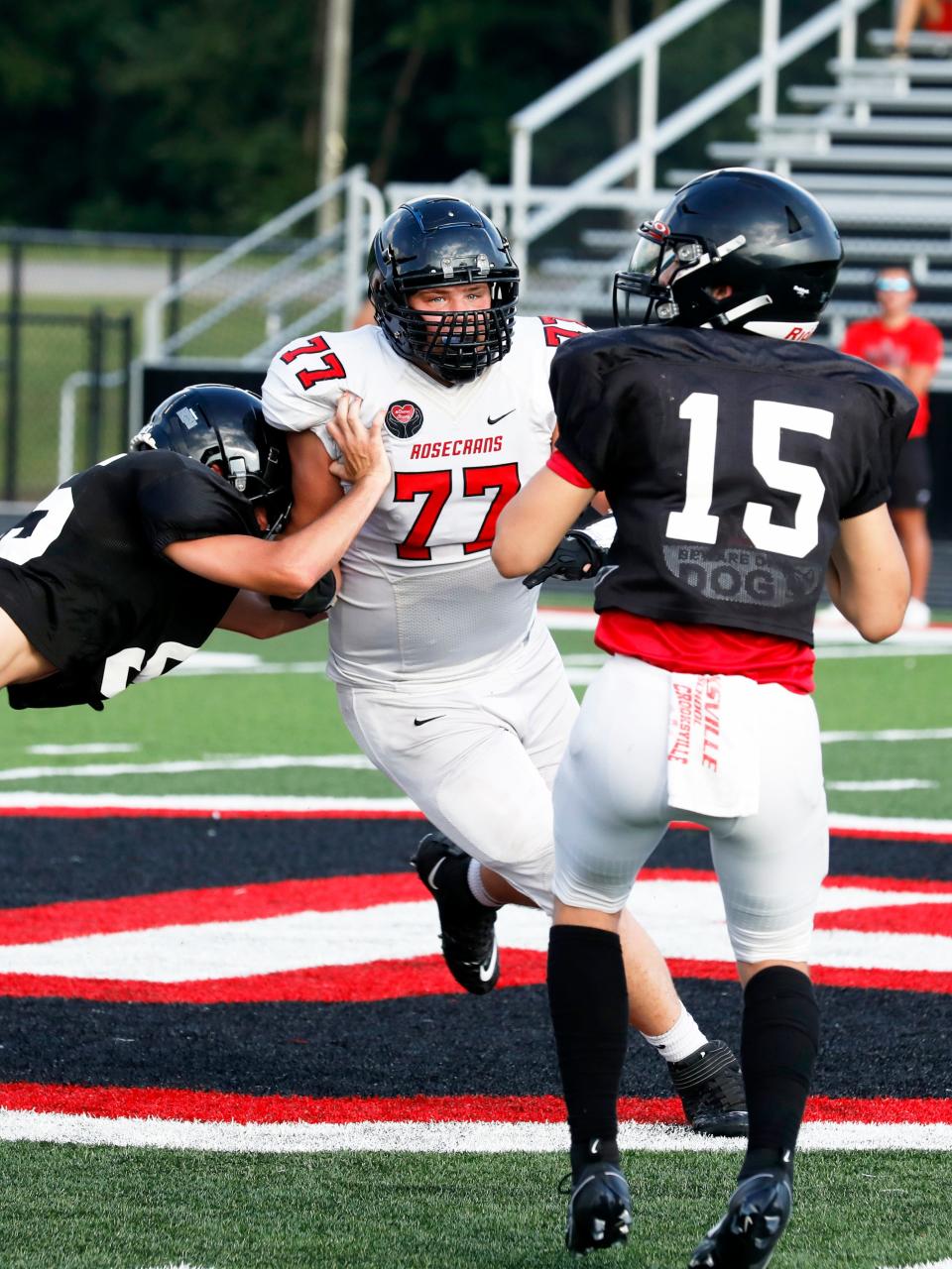 Rosecrans defensive end Xander Daniels rushes Crooksville quarterback Brayson Hill during a high school football scrimmage on Friday, Aug. 4, 2023, in McLuney, Ohio. Daniels is among the top returners for the Bishops' defense.