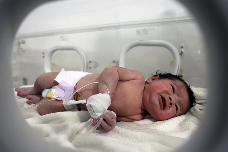 A baby girl who was born under the rubble caused by an earthquake that hit Syria and Turkey receives treatment inside an incubator at a children's hospital in the town of Afrin, Aleppo province, Syria, Tuesday, Feb. 7, 2023.