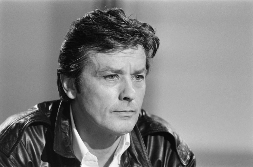 <p>French actor Alain Delon (R) attends a TV show on French channel Antenne 2, in Paris, on May 16, 1984.  AFP PHOTO GEORGES BENDRIHEM (Photo credit should read GEORGES BENDRIHEM/AFP via Getty Images)</p>
