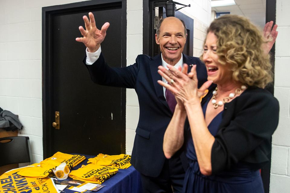 Winner of the Democratic primary for U.S. Senate Mike Franken, retired Navy admiral from Sioux City, enters his election night gathering accompanied by his wife, Jordan Franken, on Tuesday, June 7, 2022, at Franklin Junior High, in Des Moines.