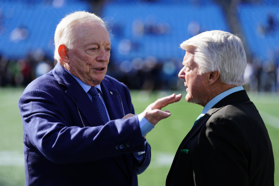 Dallas Cowboys owner Jerry Jones talks with former coach Jimmy Johnson before an NFL football game between the Carolina Panthers and the Dallas Cowboys on Sunday, Nov. 19, 2023, in Charlotte, N.C. (AP Photo/Rusty Jones)