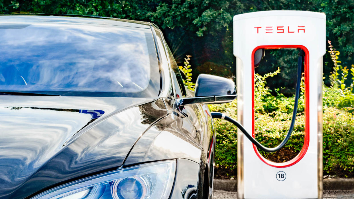 Zevenaar, The Netherlands - September 10, 2015: Black Tesla Model S electric car at a Tesla supercharger charging station.