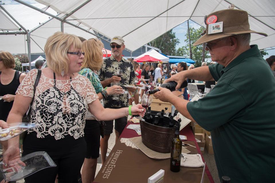 Carol Murray of Stockton has her wine glass filled by Steve Heringer with Heringer Estate Winery at the Taste of the Delta event Aug. 5, 2017, at the Stockton Yacht Club in Stockton.
