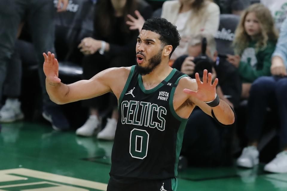 Boston Celtics' Jayson Tatum reacts to a call during the second half of Game 6 of the team's NBA basketball playoffs Eastern Conference finals against the Miami Heat, Friday, May 27, 2022, in Boston. (AP Photo/Michael Dwyer)