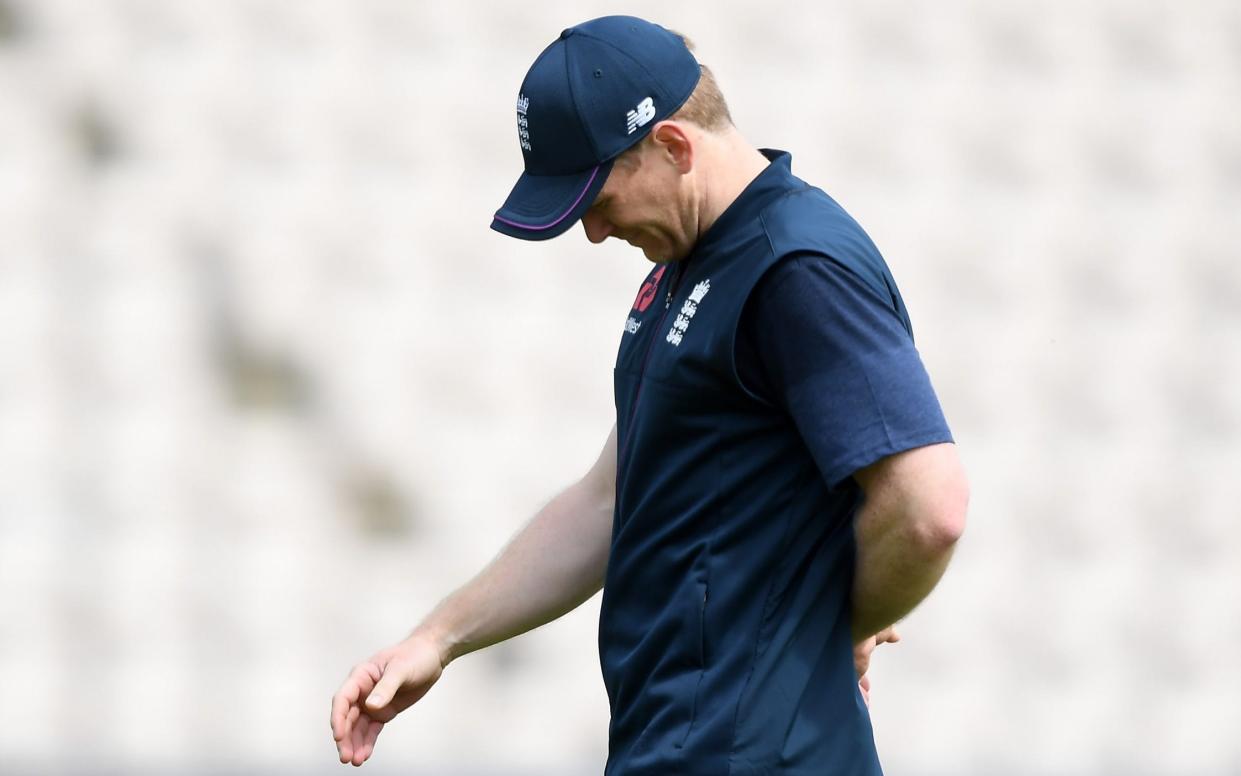 England captain Eoin Morgan walks off after injuring his finger during practice before Saturday's match against Australia - Getty Images Europe