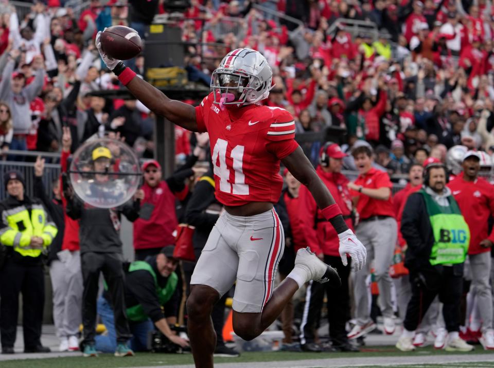Oct. 7, 2023; Columbus, Oh., USA; 
Ohio State Buckeyes safety Josh Proctor (41) runs an interception in for a touchdown during the first half of Saturday's NCAA Division I football game against the Maryland Terrapins at Ohio Stadium.
