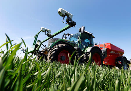 Optical sensors, Trimble Navigation Ltd’s 'GreenSeeker' devices to instantly adjust nitrogen fertilization, are seen installed at a tractor in a wheat field in the Bavarian town of Irlbach near Deggendorf, Germany, April 21, 2016. REUTERS/Michaela Rehle
