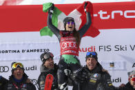 Italy's Sofia Goggia celebrates after winning an alpine ski, women's World Cup downhill race, in Cortina d'Ampezzo, Italy, Friday, Jan. 20, 2023. (AP Photo/Alessandro Trovati)