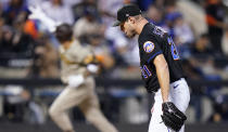 New York Mets starting pitcher Max Scherzer (21) reacts after giving up a home run to the San Diego Padres during the fifth inning of Game 1 of a National League wild-card baseball playoff series, Friday, Oct. 7, 2022, in New York. (AP Photo/Frank Franklin II)