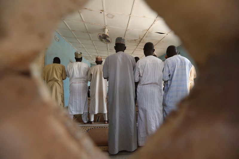 People pray in a mosque at the Government Science school in Kankara