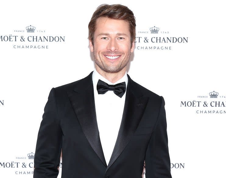 Closeup of Glen Powell in a tuxedo