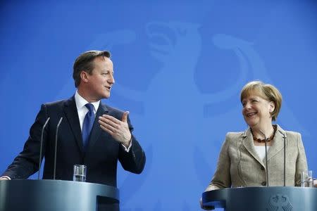 German Chancellor Angela Merkel and Britian's Prime Minister David Cameron address a joint news conference following a meeting at the Chancllery in Berlin, Germany May 29, 2015. REUTERS/Hannibal Hanschke