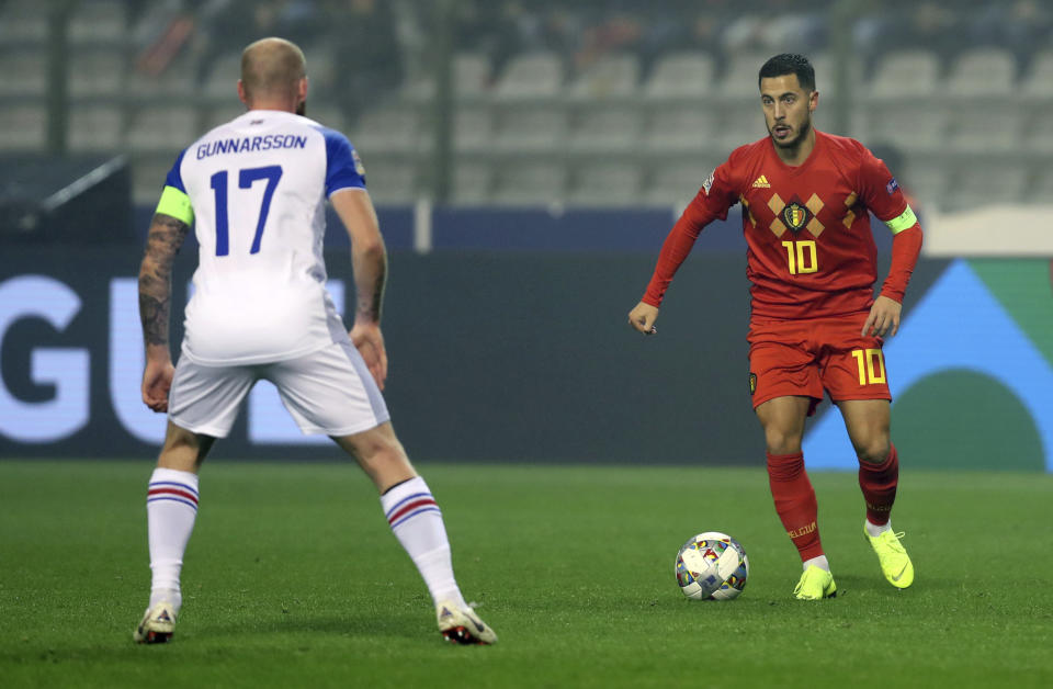 Belgium's Eden Hazard, right, vies for the ball with Iceland's Aron Gunnarsson during the UEFA Nations League soccer match between Belgium and Iceland at the King Baudouin stadium in Brussels, Thursday, Nov. 15, 2018. (AP Photo/Francisco Seco)