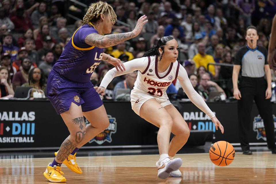 Virginia Tech's Kayana Traylor tries to get past LSU's Kateri Poole during the second half of an NCAA Women's Final Four semifinals basketball game Friday, March 31, 2023, in Dallas. (AP Photo/Tony Gutierrez)