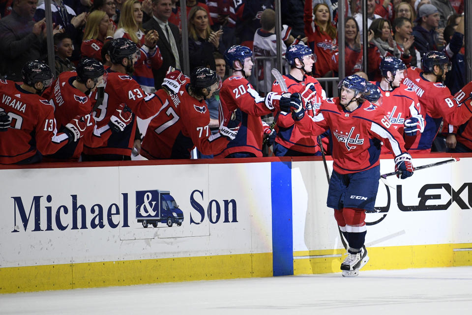 Washington Capitals left wing Carl Hagelin (62), of Sweden, celebrates his goal with the bench during the second period of an NHL hockey game against the Winnipeg Jets, Sunday, March 10, 2019, in Washington. (AP Photo/Nick Wass)